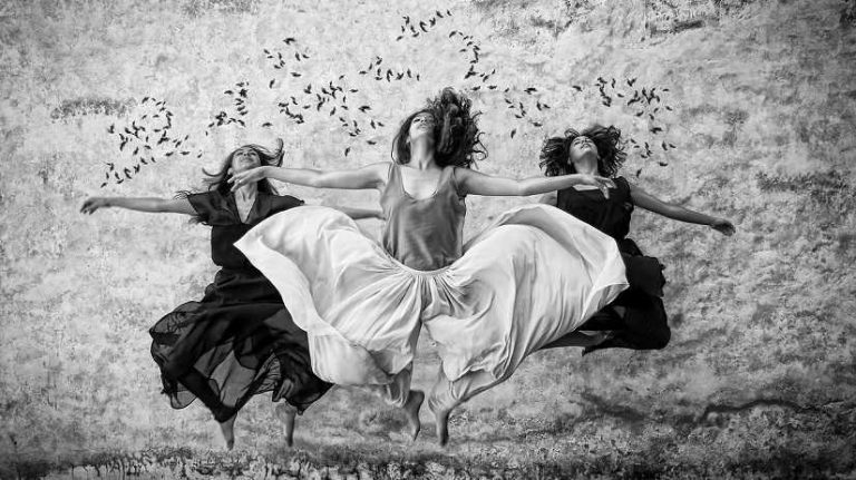 We are spiritual beings having a human experience, Three women jump in the air